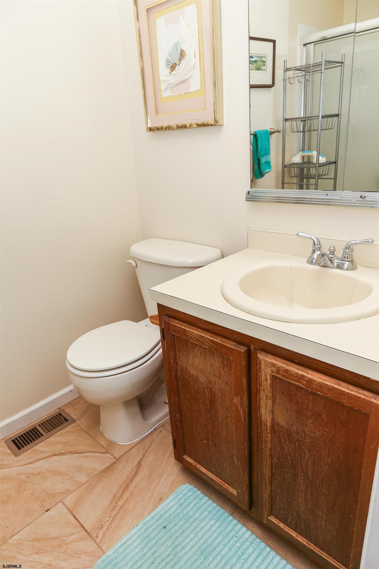 340 Seashell Lane Brigantine, NJ 08203 - Photo 25 of 29 a bathroom with a sink and a toilet