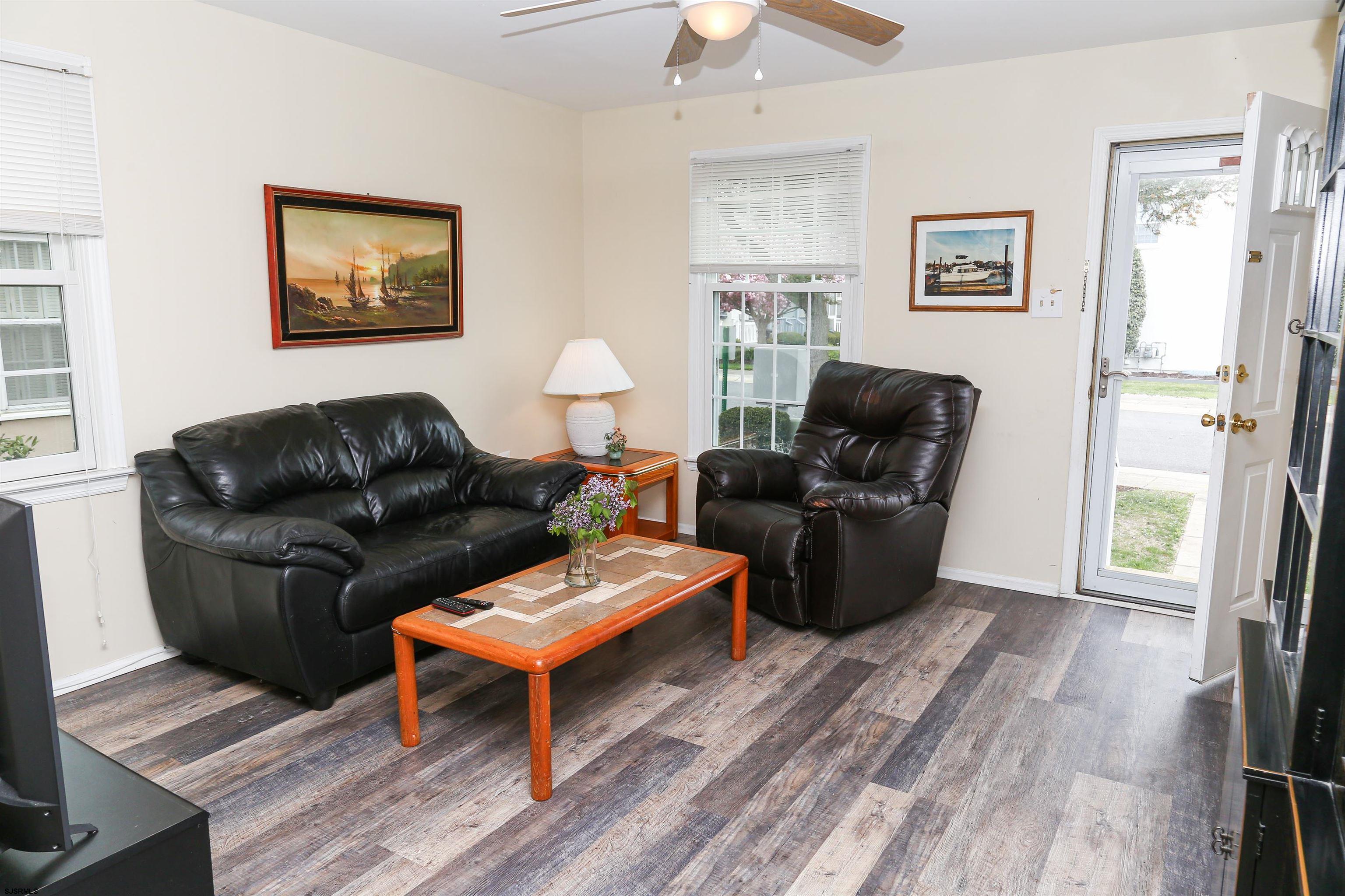 340 Seashell Lane Brigantine, NJ 08203 - Photo 5 of 29 a living room with furniture and a wooden floor