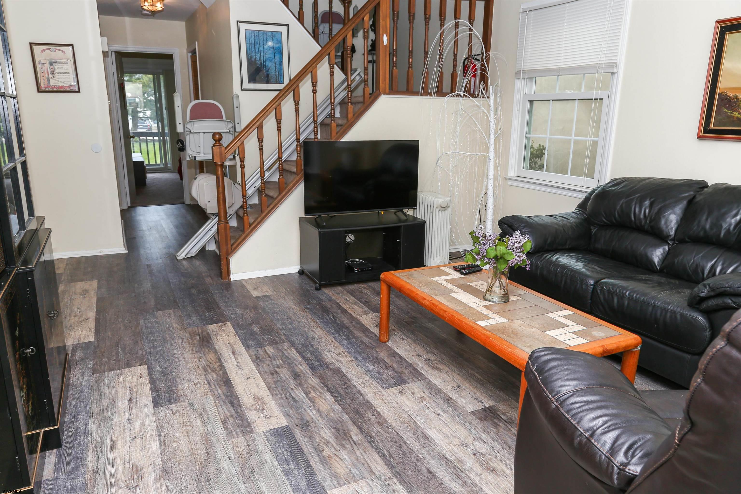 340 Seashell Lane Brigantine, NJ 08203 - Photo 6 of 29 a living room with furniture and a flat screen tv