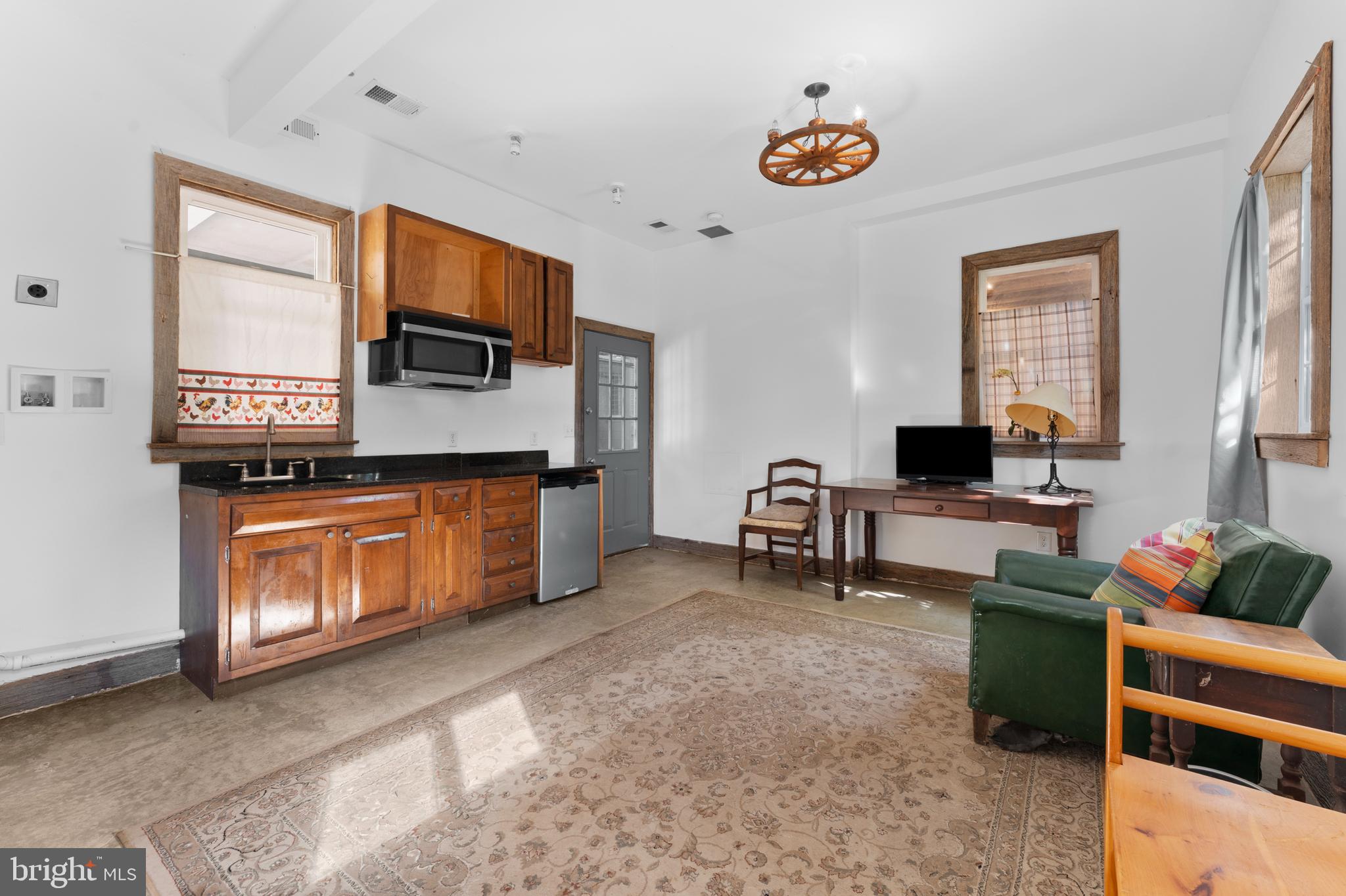 439 Rudasill Mill Road Woodville, VA 22749 - Photo 19 of 48 a living room with furniture and a flat screen tv