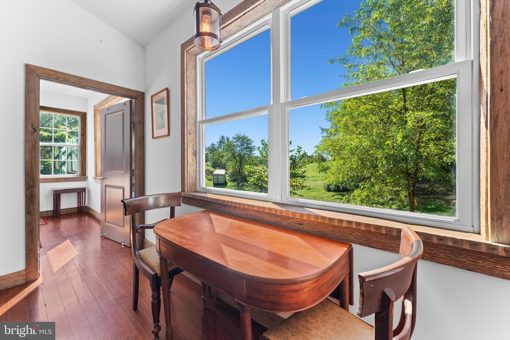 439 Rudasill Mill Road Woodville, VA 22749 - Photo 31 of 48 a dining room with furniture and wooden floor
