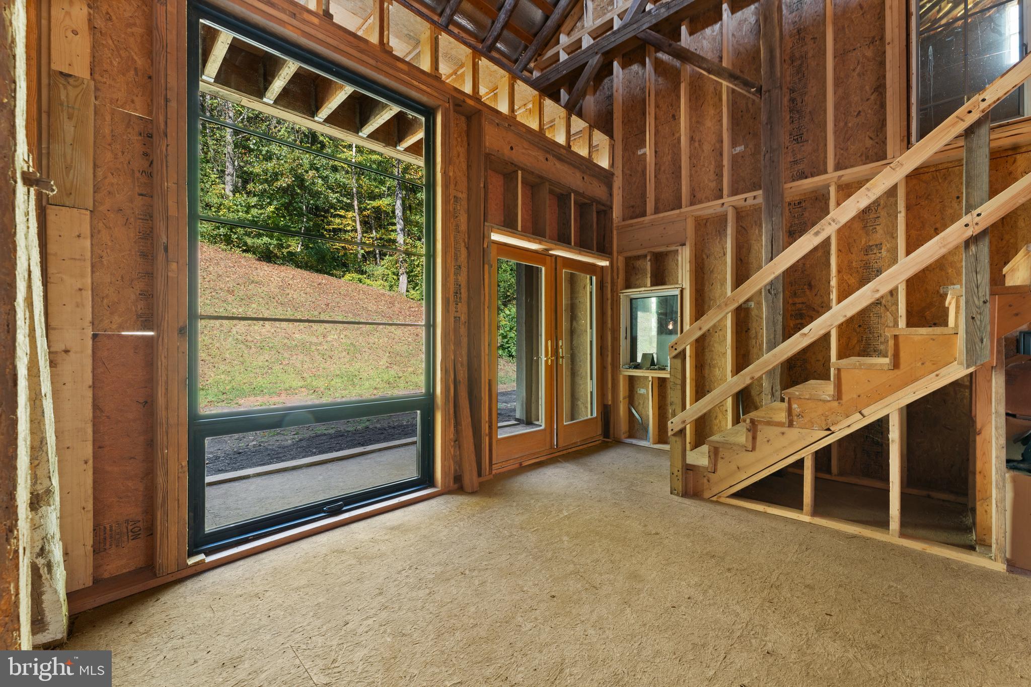 439 Rudasill Mill Road Woodville, VA 22749 - Photo 42 of 48 a view of an empty room with a balcony and door