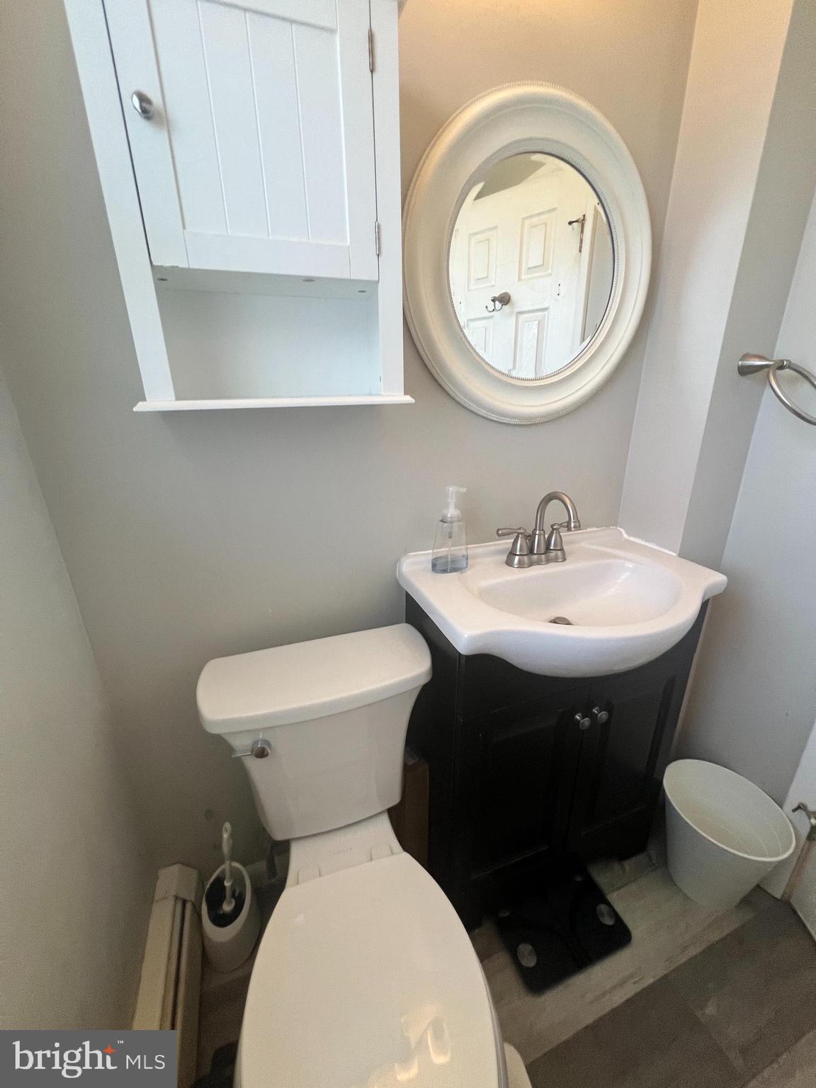 1075 Haverford Road Ridley Park, PA 19078 - Photo 10 of 14 a bathroom with a toilet sink and mirror