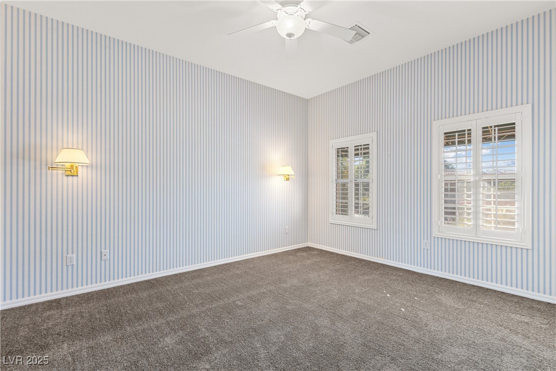 10548 Findlay Avenue Las Vegas, NV 89134 - Photo 18 of 27 Unfurnished room with dark colored carpet and ceiling fan