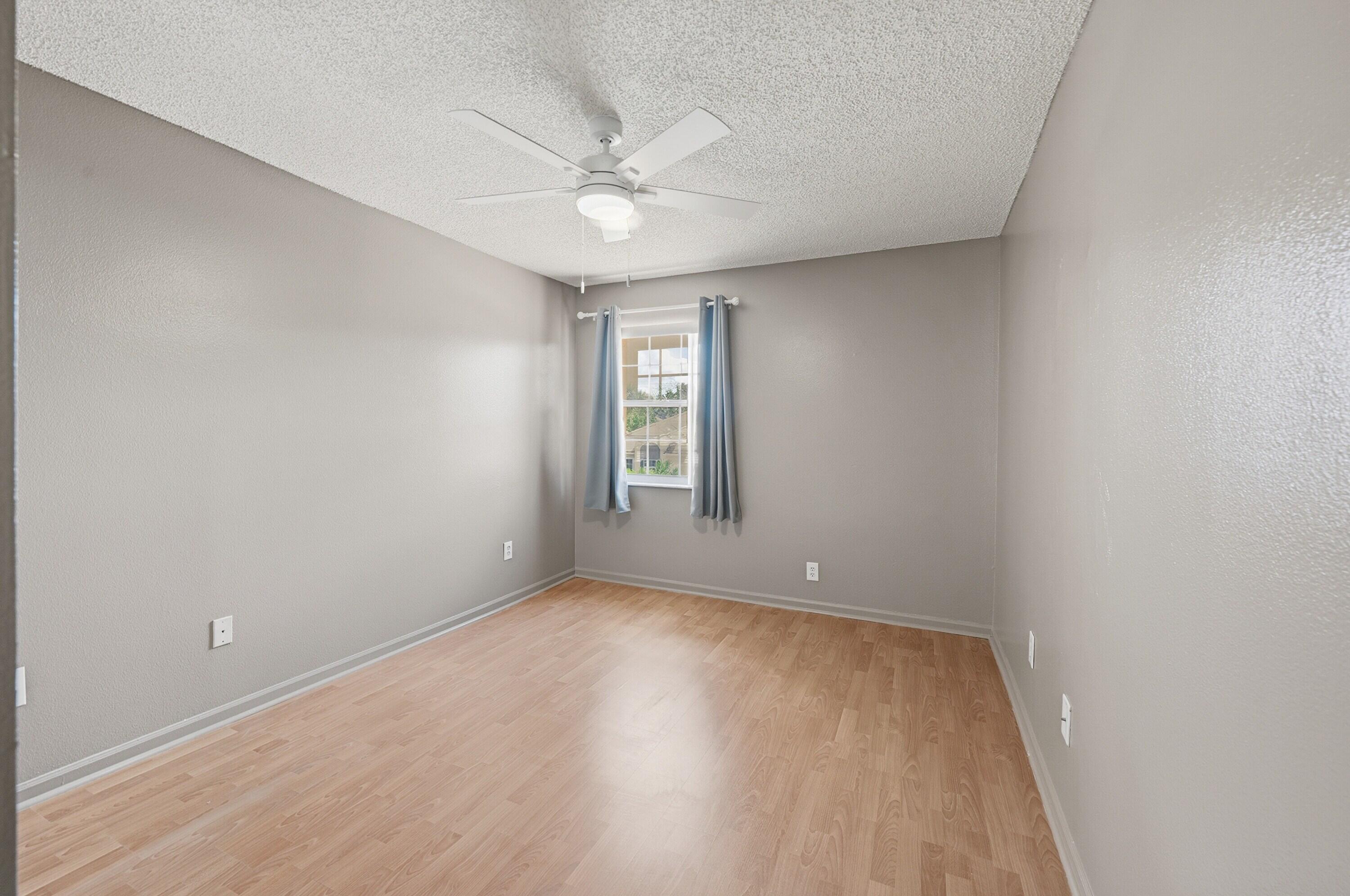 18474 Old Princeton Lane Boca Raton, FL 33498 - Photo 31 of 46 wooden floor in an empty room with a window