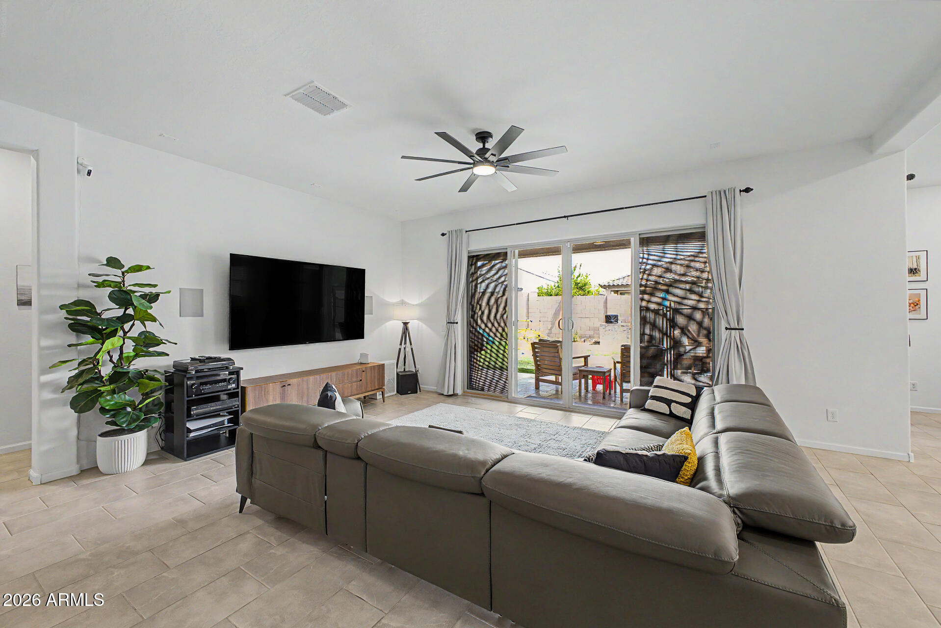 6511 West Steed Ridge Phoenix, AZ 85083 - Photo 6 of 41 a living room with furniture and a flat screen tv