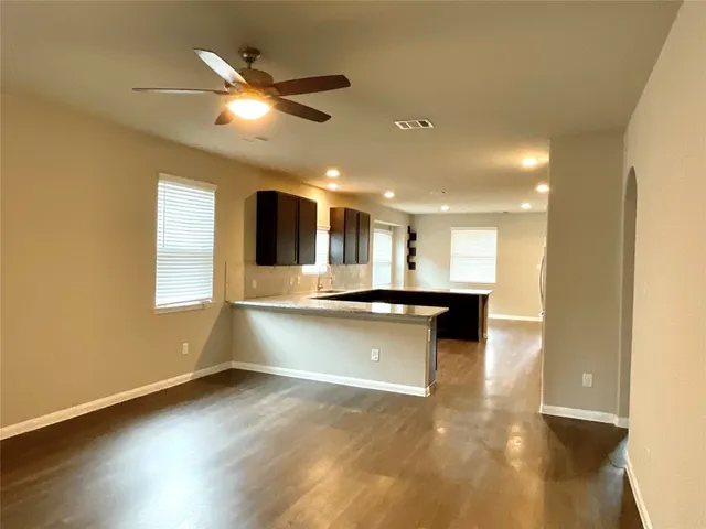 a kitchen with stainless steel appliances granite countertop a sink and a microwave