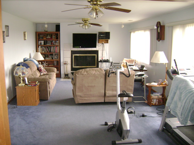 877 North 3450th Road Utica, IL 61373 - Photo 7 of 12 a living room with furniture a window and a flat screen tv