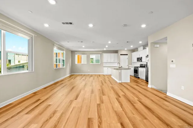 a bedroom with bed and a window