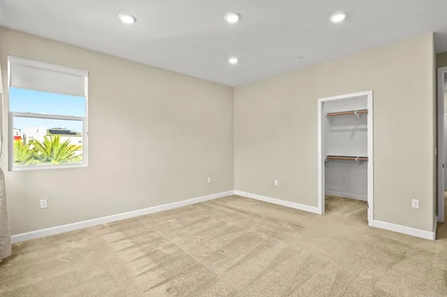 a white bath tub sitting next to a shower
