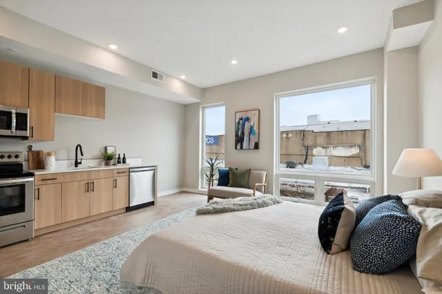 a bedroom with a bed and window