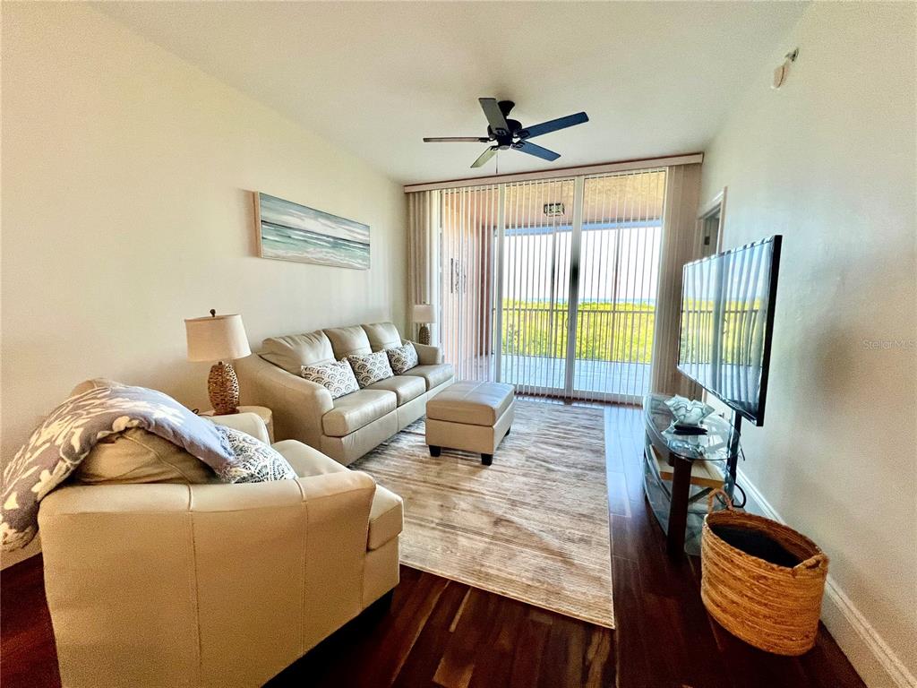 3191 Matecumbe Key Road, Unit 206 Punta Gorda, FL 33955 - Photo 13 of 45 a living room with furniture and a window