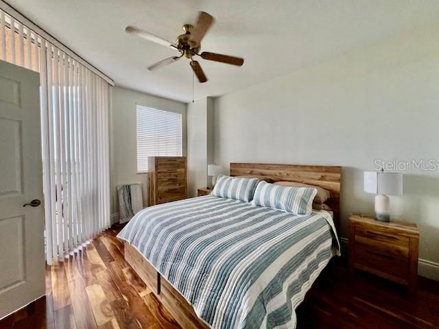 3191 Matecumbe Key Road, Unit 206 Punta Gorda, FL 33955 - Photo 18 of 45 a bedroom with a bed and a chandelier