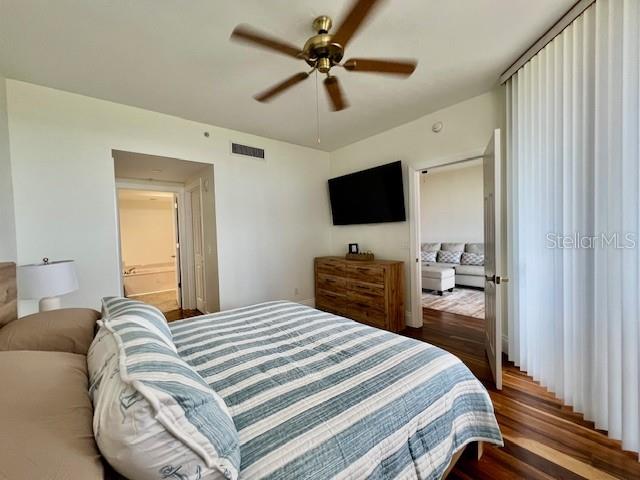 3191 Matecumbe Key Road, Unit 206 Punta Gorda, FL 33955 - Photo 19 of 45 a bedroom with a bed and a flat screen tv