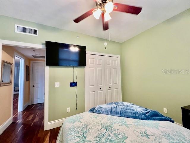 3191 Matecumbe Key Road, Unit 206 Punta Gorda, FL 33955 - Photo 23 of 45 a bedroom with a bed and a flat screen tv