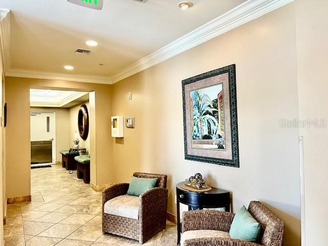 3191 Matecumbe Key Road, Unit 206 Punta Gorda, FL 33955 - Photo 27 of 45 a living room with furniture and a chandelier