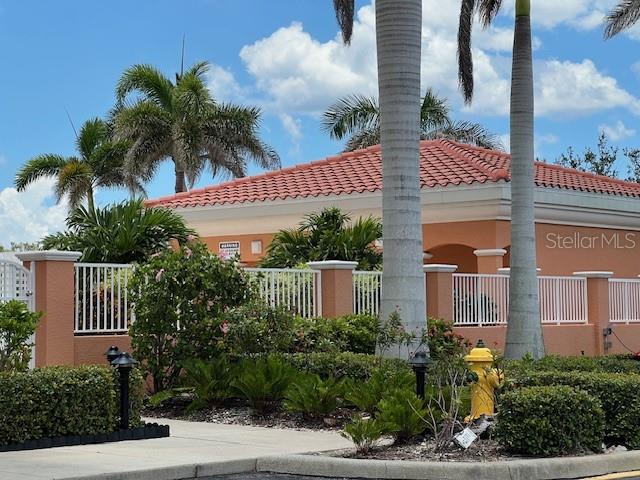 3191 Matecumbe Key Road, Unit 206 Punta Gorda, FL 33955 - Photo 30 of 45 a front view of multi story residential apartment building with yard and entryway