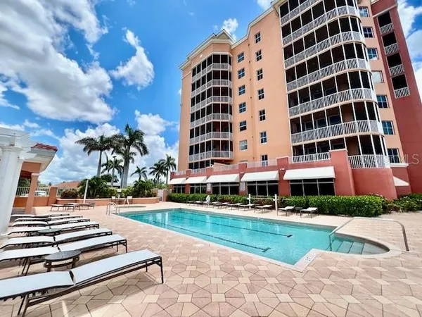a view of a swimming pool with a patio