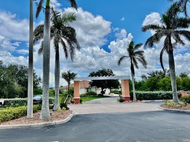 3191 Matecumbe Key Road, Unit 206 Punta Gorda, FL 33955 - Photo 32 of 45 a front view of a house with palm trees