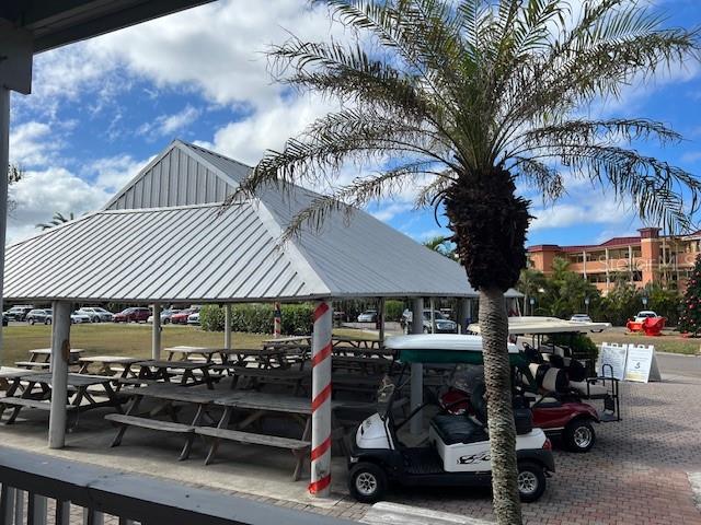 3191 Matecumbe Key Road, Unit 206 Punta Gorda, FL 33955 - Photo 40 of 45 a view of a chairs and tables in patio
