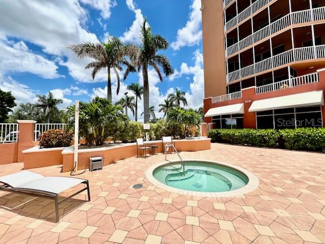 3191 Matecumbe Key Road, Unit 206 Punta Gorda, FL 33955 - Photo 5 of 45 a view of a swimming pool with a patio