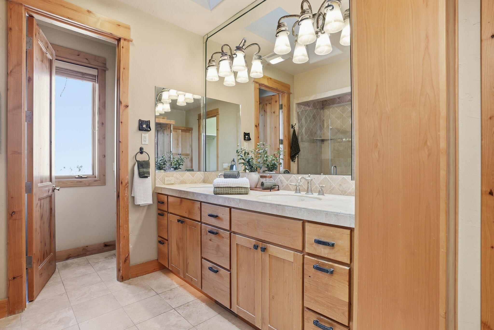 631 Sundance Ridge Court Redmond, OR 97756 - Photo 45 of 61 a bathroom with a sink and a mirror
