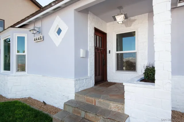 a modern kitchen with stainless steel appliances granite countertop a refrigerator and a sink