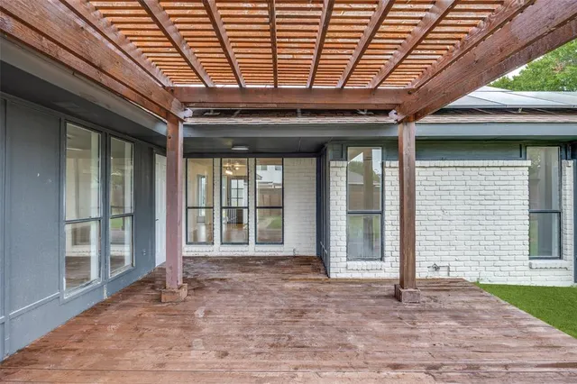a front view of a house with a garden and yard