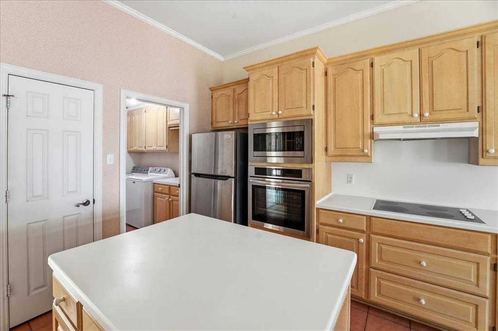 15744 Timberhill Drive Flint, TX 75762 - Photo 2 of 35 a kitchen with kitchen island a refrigerator sink and cabinets