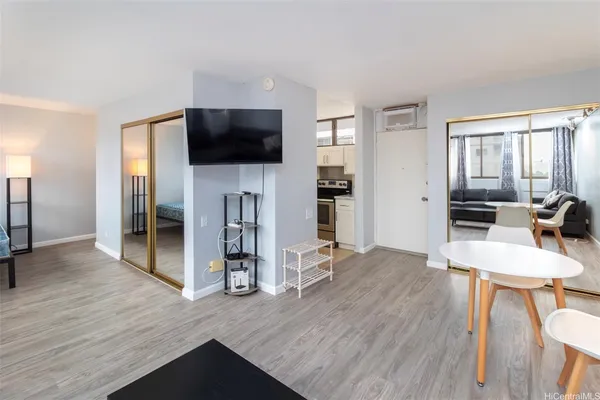a view of a livingroom with furniture and a flat screen tv