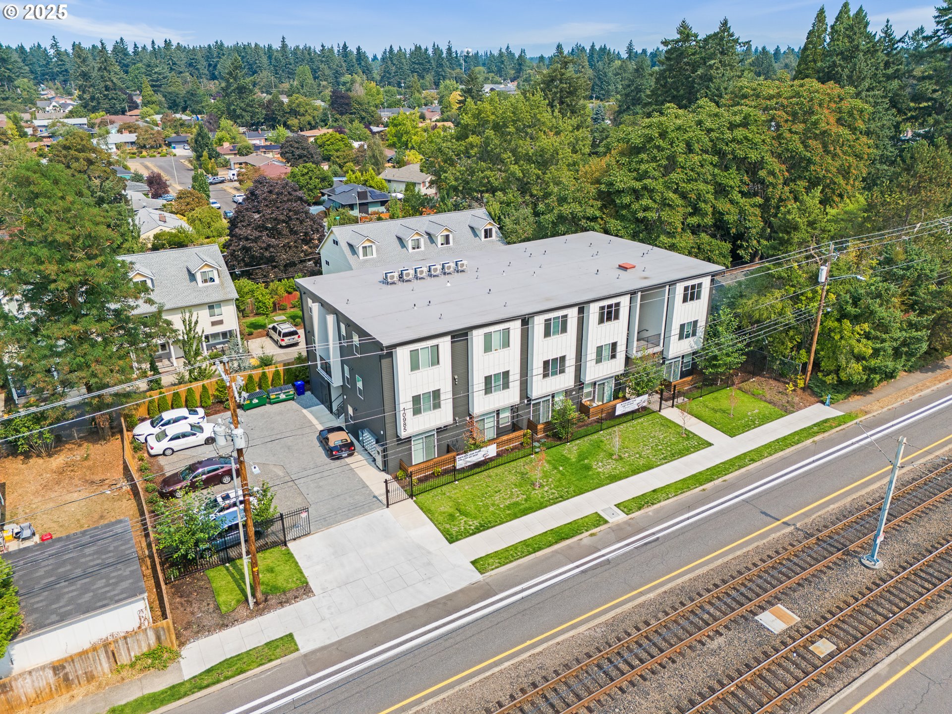 10985 East Burnside Street, Unit 24 Portland, OR 97216 - Photo 9 of 9 an aerial view of a house with a big yard