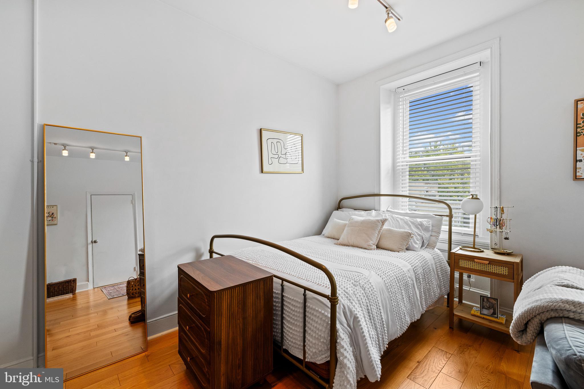 726 South 19th Street Philadelphia, PA 19146 - Photo 6 of 12 a bedroom with a bed and a night stand