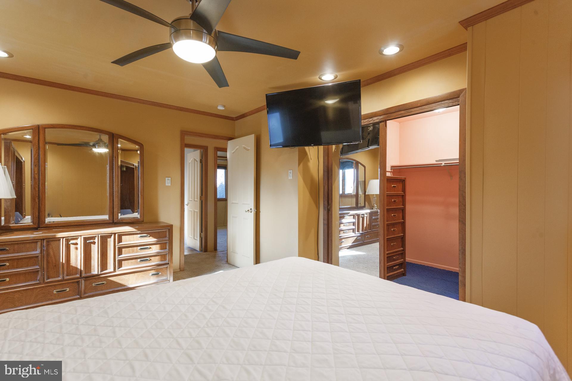 514 Drexel Road Fairless Hills, PA 19030 - Photo 20 of 31 a bedroom with a bed ceiling fan and a large window