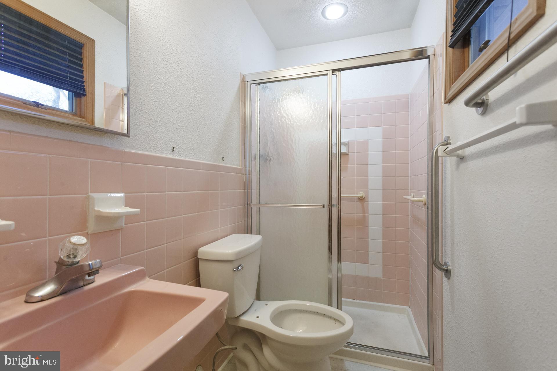 514 Drexel Road Fairless Hills, PA 19030 - Photo 26 of 31 a bathroom with a sink a toilet and shower
