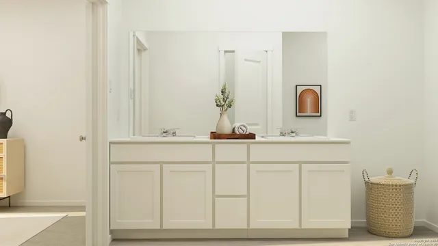 a bathroom with a sink and a mirror