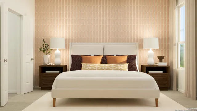 a bedroom with a bed and a lamp