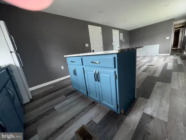 a view of a kitchen from the hallway