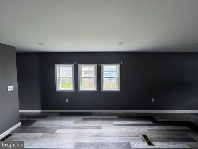 a kitchen with a refrigerator and a sink