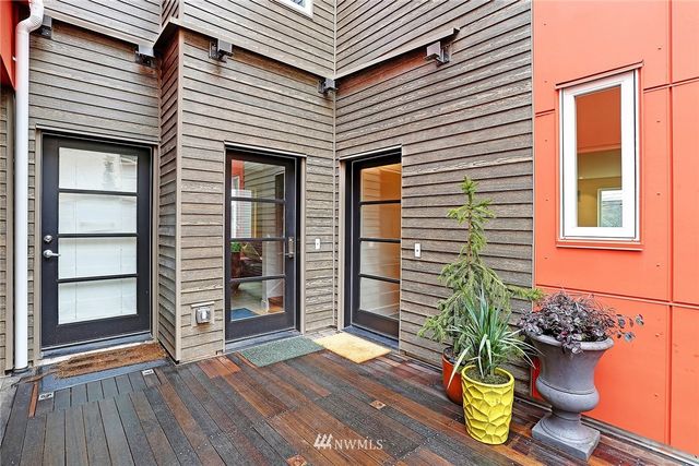 a view of a house with porch and wooden floor