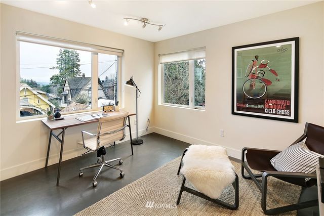 a workspace with furniture and a window