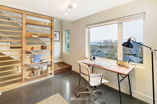 a bedroom with a bed and a cabinets