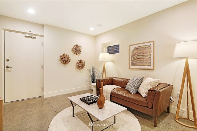 a living room with furniture and a table