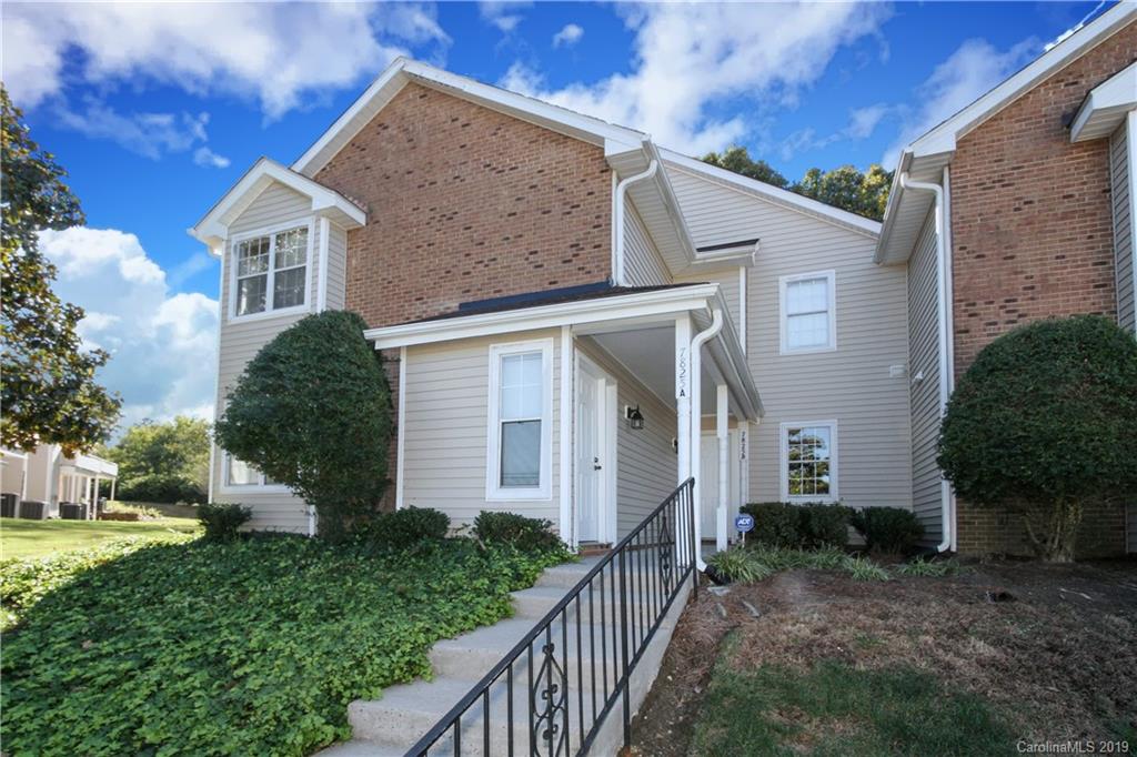 7825 Renaissance Court, Unit B Charlotte, NC 28226 - Photo 2 of 21 a front view of a house with a yard