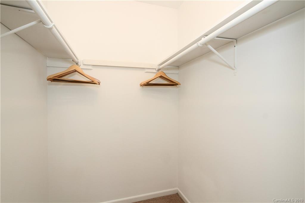 7825 Renaissance Court, Unit B Charlotte, NC 28226 - Photo 11 of 21 a view of small space with racks on the wall