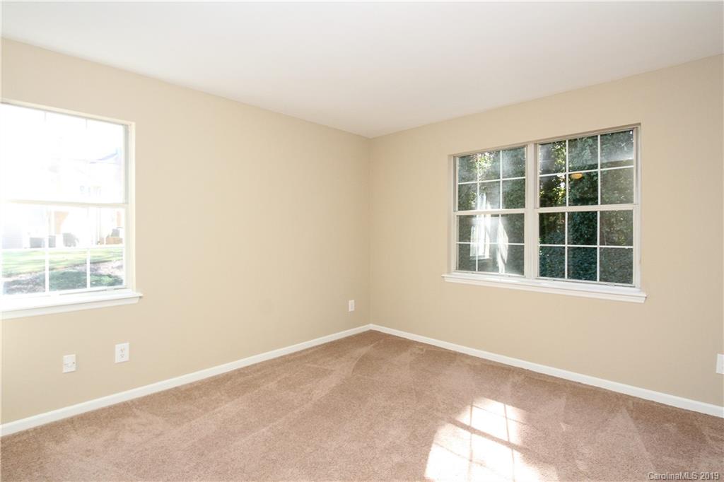 7825 Renaissance Court, Unit B Charlotte, NC 28226 - Photo 13 of 21 an empty room with a window
