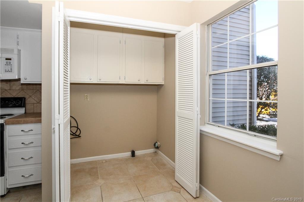 7825 Renaissance Court, Unit B Charlotte, NC 28226 - Photo 15 of 21 a view of walk in closet with clothes