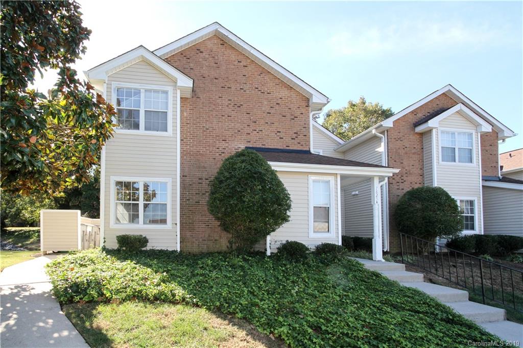 7825 Renaissance Court, Unit B Charlotte, NC 28226 - Photo 18 of 21 front view of a house with a yard