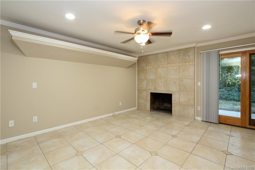 7825 Renaissance Court, Unit B Charlotte, NC 28226 - Photo 3 of 21 a view of an empty room with a fireplace