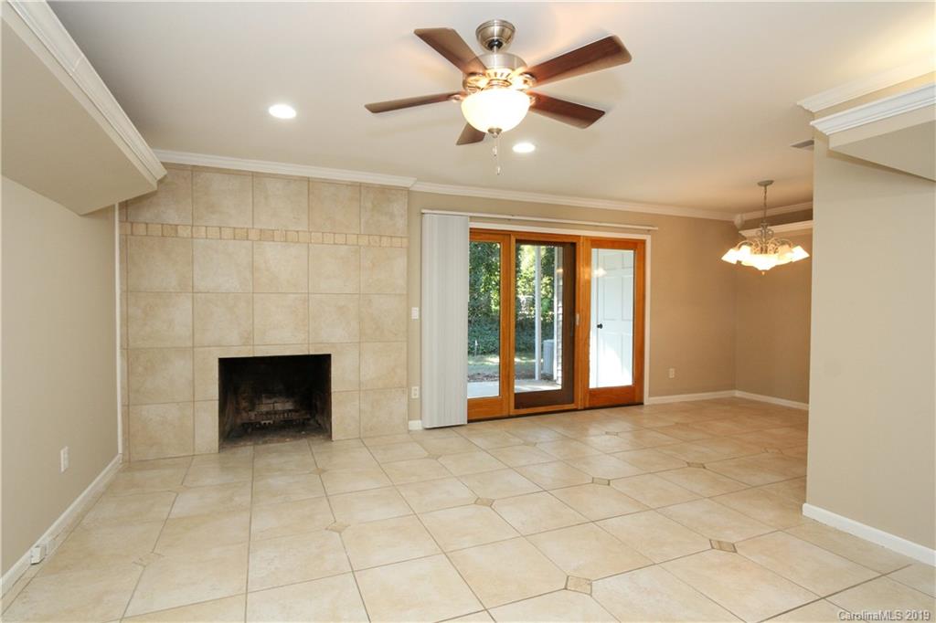7825 Renaissance Court, Unit B Charlotte, NC 28226 - Photo 4 of 21 a view of an empty room with a fireplace