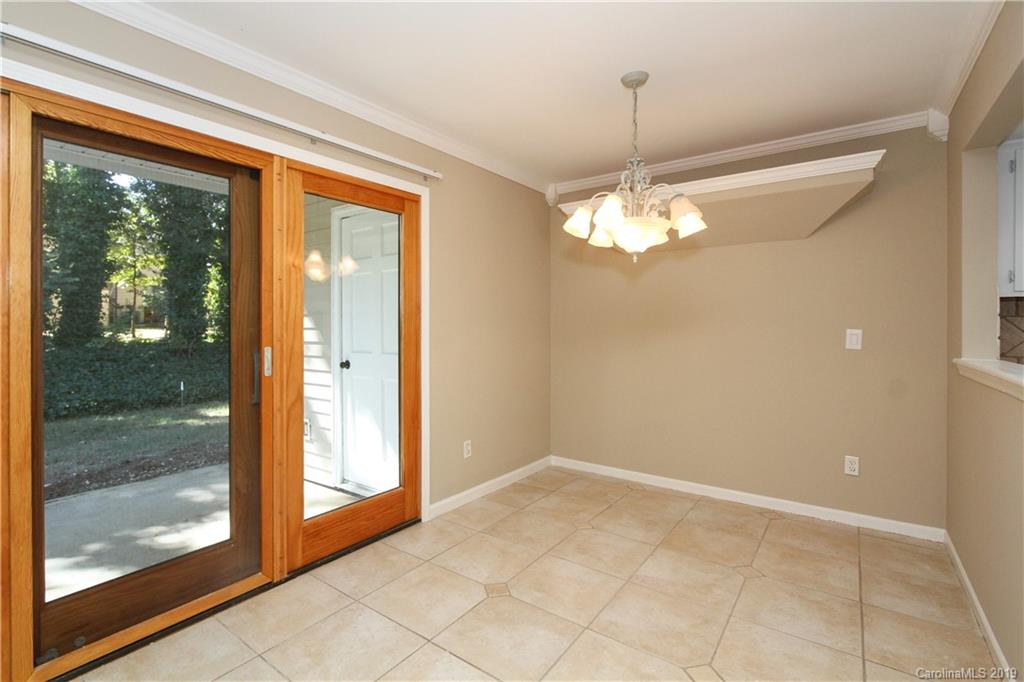7825 Renaissance Court, Unit B Charlotte, NC 28226 - Photo 5 of 21 a view of a glass door with a glass door and windows